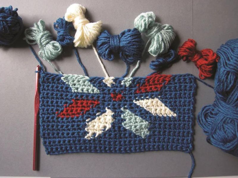a crochet block made with an intarsia colorwork technique