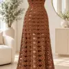 Cocoa brown crochet maxi dress with oval lace pattern displayed on dress form showing fitted bodice and flared skirt