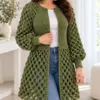Olive green bobble lace cardigan with balloon sleeves and fitted ribbed cuffs worn over white top with jeans