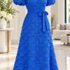 Royal blue crochet fan shell dress on mannequin showing textured overlapping shells and scalloped hem