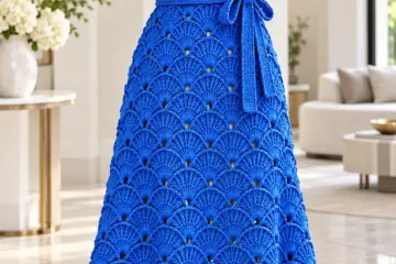 Royal blue crochet fan shell dress on mannequin showing textured overlapping shells and scalloped hem